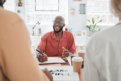 Buy stock photo Group of diverse businesspeople having a meeting in a modern office at work. Young happy african american businessman wearing glasses talking about an idea while sitting in a boardroom with colleagues. Creative businesspeople planning together