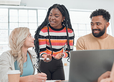 Buy stock photo Group of diverse businesspeople having a meeting in a modern office at work. Young african american businesswoman talking to her colleagues while using a laptop. Businesspeople planning together
