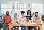 Portrait of a group of happy diverse businesspeople having a meeting in a modern office at work. Cheerful business professionals sitting at a table. Creative businesspeople planning together