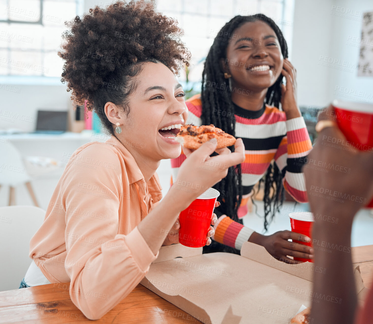 Buy stock photo Young cheerful mixed race businesswoman eating lunch with hr colleagues at work. Group of joyful coworkers having pizza together in an office at work