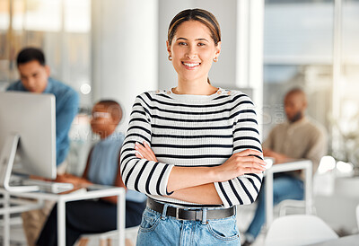 Buy stock photo Young happy mixed race businesswoman standing with her arms crossed while in an office. Confident and content hispanic female boss smiling and standing at work