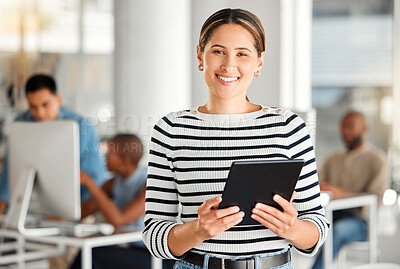 Buy stock photo Portrait of a cheerful mixed race businesswoman working on a digital tablet at work. Happy hispanic female smiling while using social media on a digital tablet. Businessperson checking an email on a digital tablet