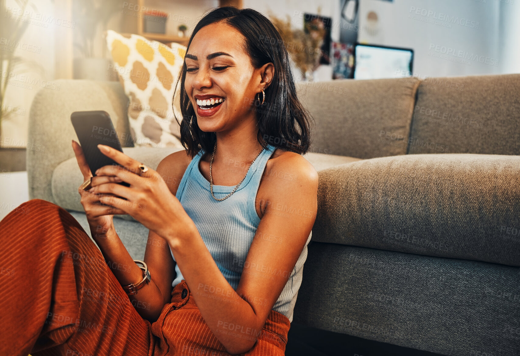 Buy stock photo Woman laughing at chat on smartphone, social media and funny meme with communication and technology. Female person relax at home, using phone and comedy online with streaming and texting on app