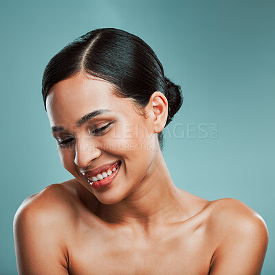 Buy stock photo A young beautiful mixed race woman with smooth soft skin posing and smiling against a green studio background. Attractive Hispanic female with stylish makeup posing in studio