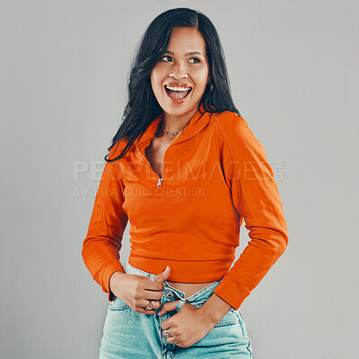 Buy stock photo Mixed race woman isolated against grey background in studio with copyspace and feeling flirty. Young, sultry, seductive hispanic standing alone. One playful model posing with confidence and attitude