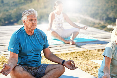 Buy stock photo Senior men and women sitting in lotus position and practising meditation during yoga exercise in nature and feeling calm. Retirees living healthy active lifestyle