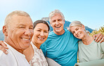 Portrait of a group of senior friends standing together. Smiling active senior people standing together after or before group yoga training in nature