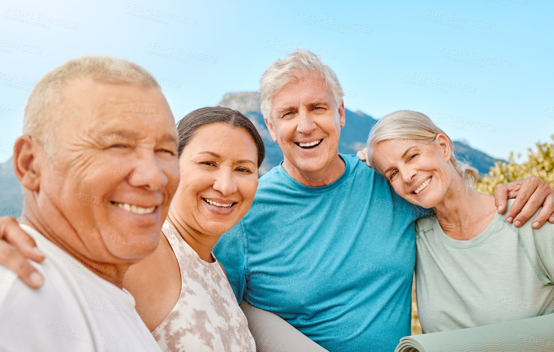 Buy stock photo Portrait of a group of senior friends standing together. Smiling active senior people standing together after or before group yoga training in nature