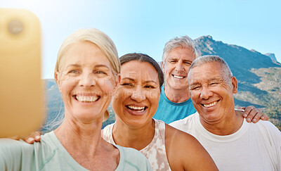 Buy stock photo Group of active seniors posing together for a selfie or video call on a sunny day against a mountain view background. Happy retirees exercising together outdoors. Living healthy and active lifestyles