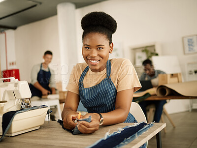 Buy stock photo Happy designer cutting fabric. African american tailor cutting denim. Fashion designer cutting denim material with a scissor. Portrait of happy seamstress cutting textiles in her studio.