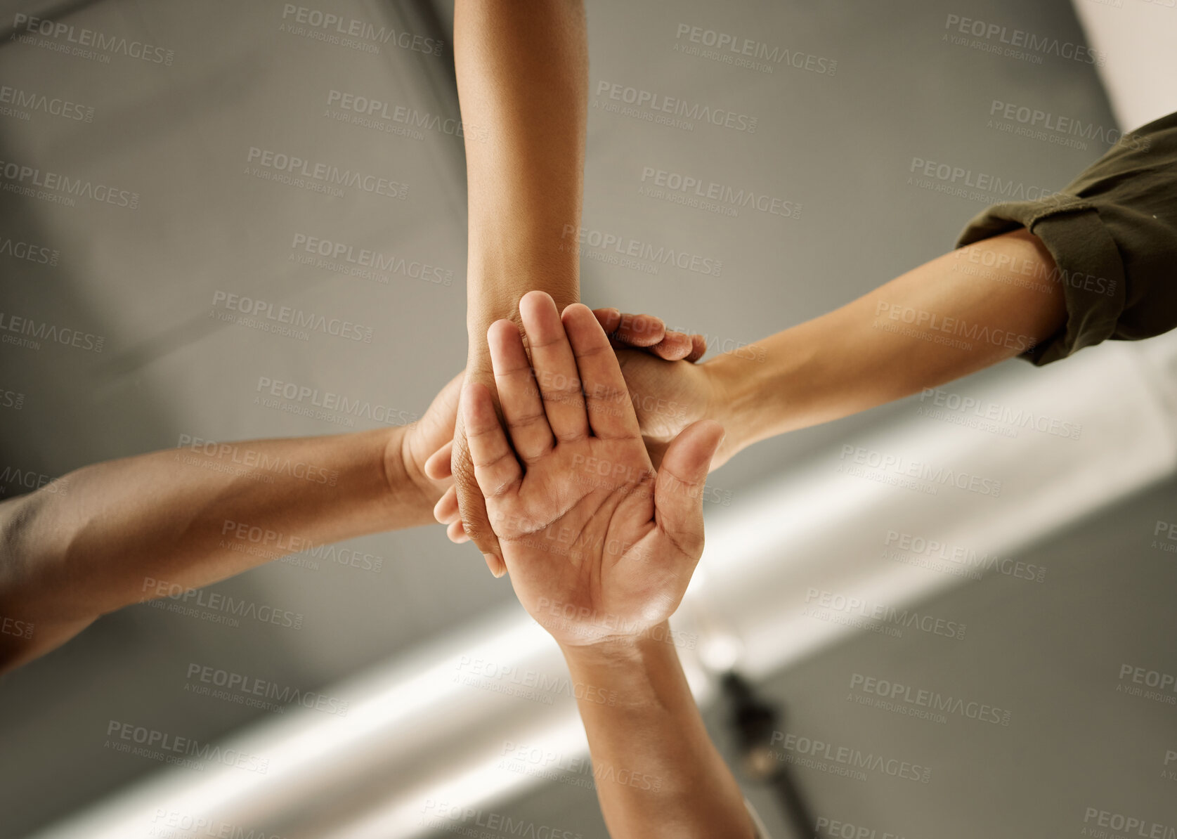 Buy stock photo Closeup of hands of businesspeople stacked from below. Group of fashion designers joined in unity.Tailors celebrate with their hands piled. Creative entrepreneurs collaborate in their studio.