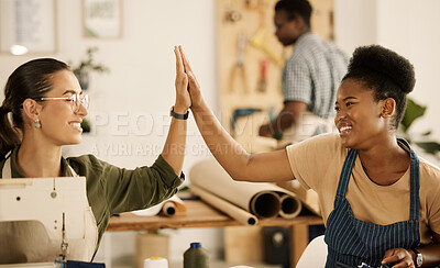 Buy stock photo Excited tailors celebrate with high five. Happy fashion designers celebrating. Seamstress colleagues collaborate together. Team of dressmakers motivate each other. Businesswoman celebrate with passion