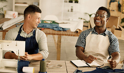 Buy stock photo Two tailors talking and laughing. Cheerful businessmen collaborating and talking. Two design colleagues planning their strategy. Diverse coworkers talking about their design.