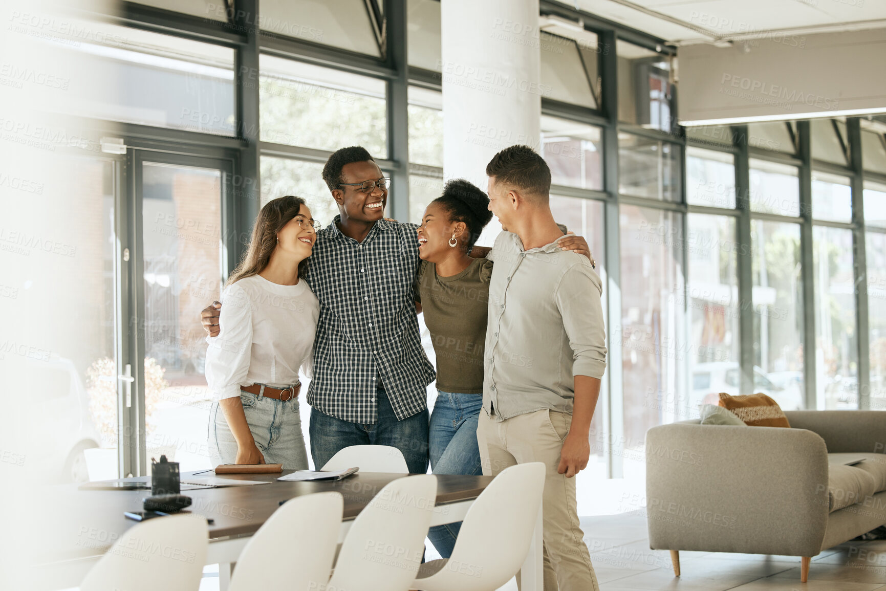 Buy stock photo Multiethnic smiling optimistic confident professional coworkers embracing in modern office and demonstrating unity. Business team standing together in startup