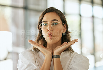 Buy stock photo Funny business woman with glasses posing with her hands under her face and making fish face grimace with pout lips in an office. Playful hispanic female entrepreneur fooling and and being silly