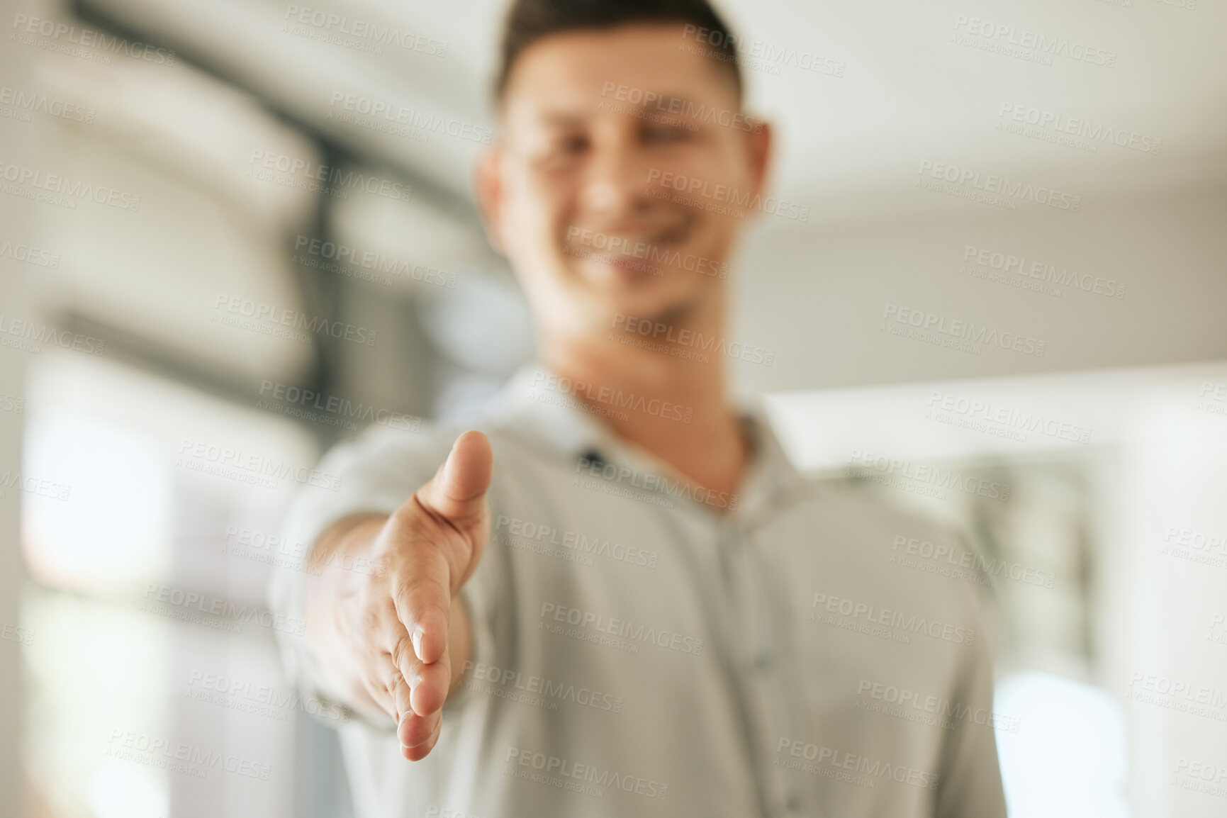 Buy stock photo Close up of business man extending his arm offering handshake to welcome new partner while standing in an office. HR manager greeting or hiring for job opportunity