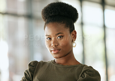 Buy stock photo Portrait of a confident young professional african american business woman standing in an office and looking at camera. Determined female entrepreneur