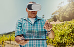Senior mixed race farmer using virtual reality headset and digital tablet with cgi. Hispanic elderly man using technology in metaverse to browse data. Old man standing and using vr for a simulation