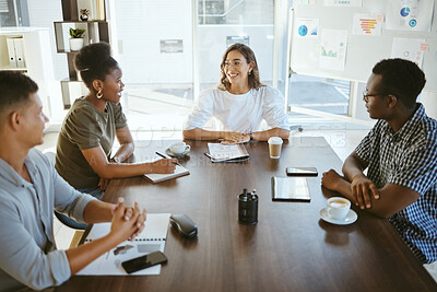 Buy stock photo Group of diverse businesspeople having a meeting in an office at work. Happy mixed race businesswoman talking during a workshop at a table with coworkers. Businesspeople planning together