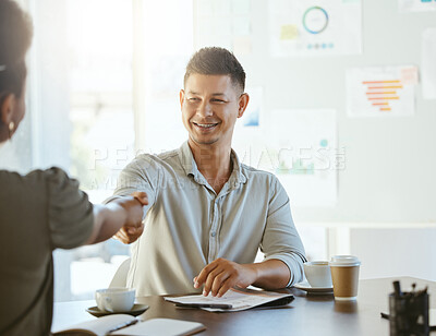 Buy stock photo Two businesspeople shaking hands while in an office together at work. Business professionals greeting and making deals with each other. Hispanic boss hiring an employee in an interview