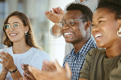 Buy stock photo Group of joyful diverse businesspeople clapping hands in support during a meeting together at work. Happy african american businessman wearing glasses giving a coworker an applause in a workshop