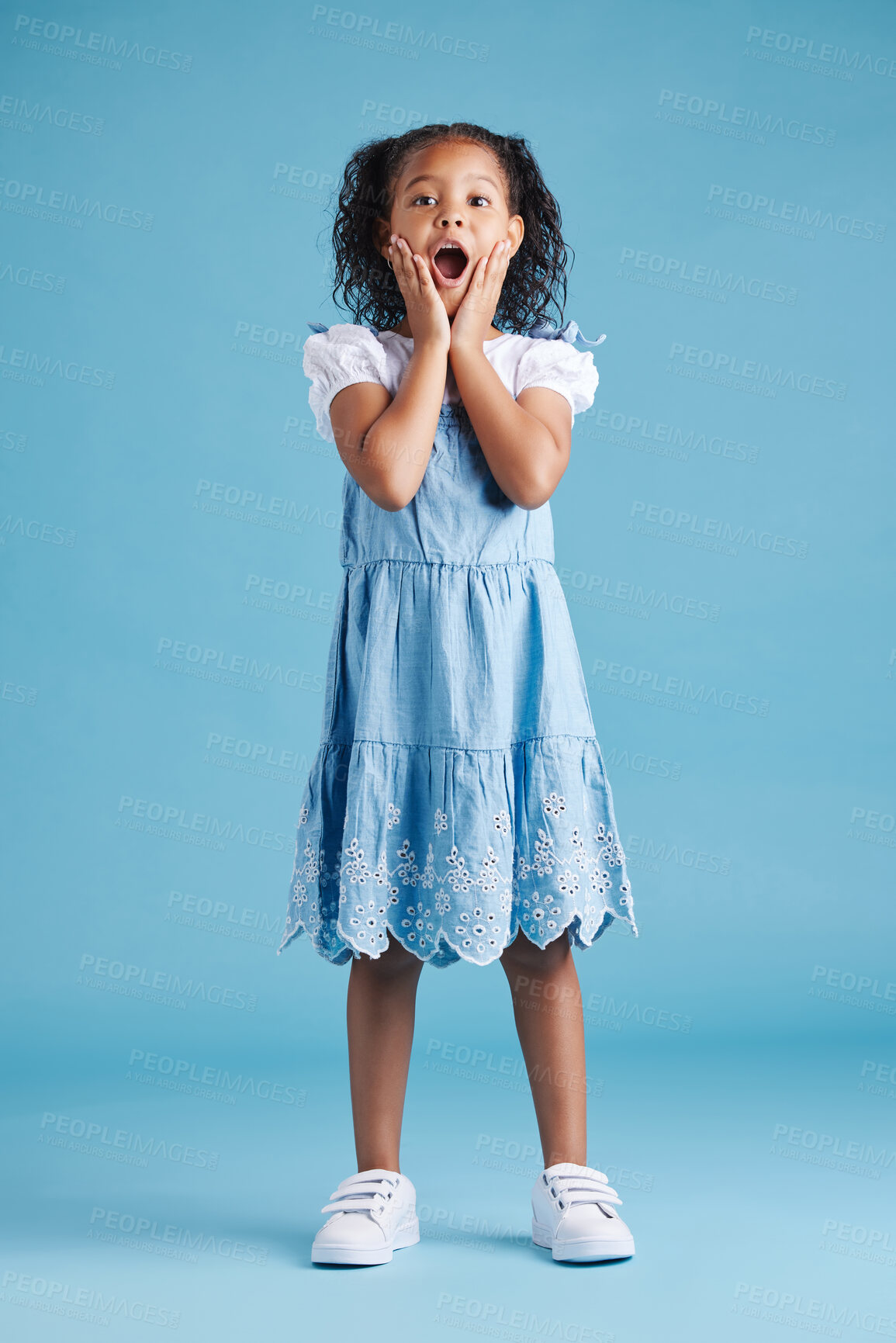 Buy stock photo Hands, surprise and portrait of child in studio for announcement, information or facial expression. Shocked, kid and face of little girl with emoji reaction for news, secret or wow by blue background