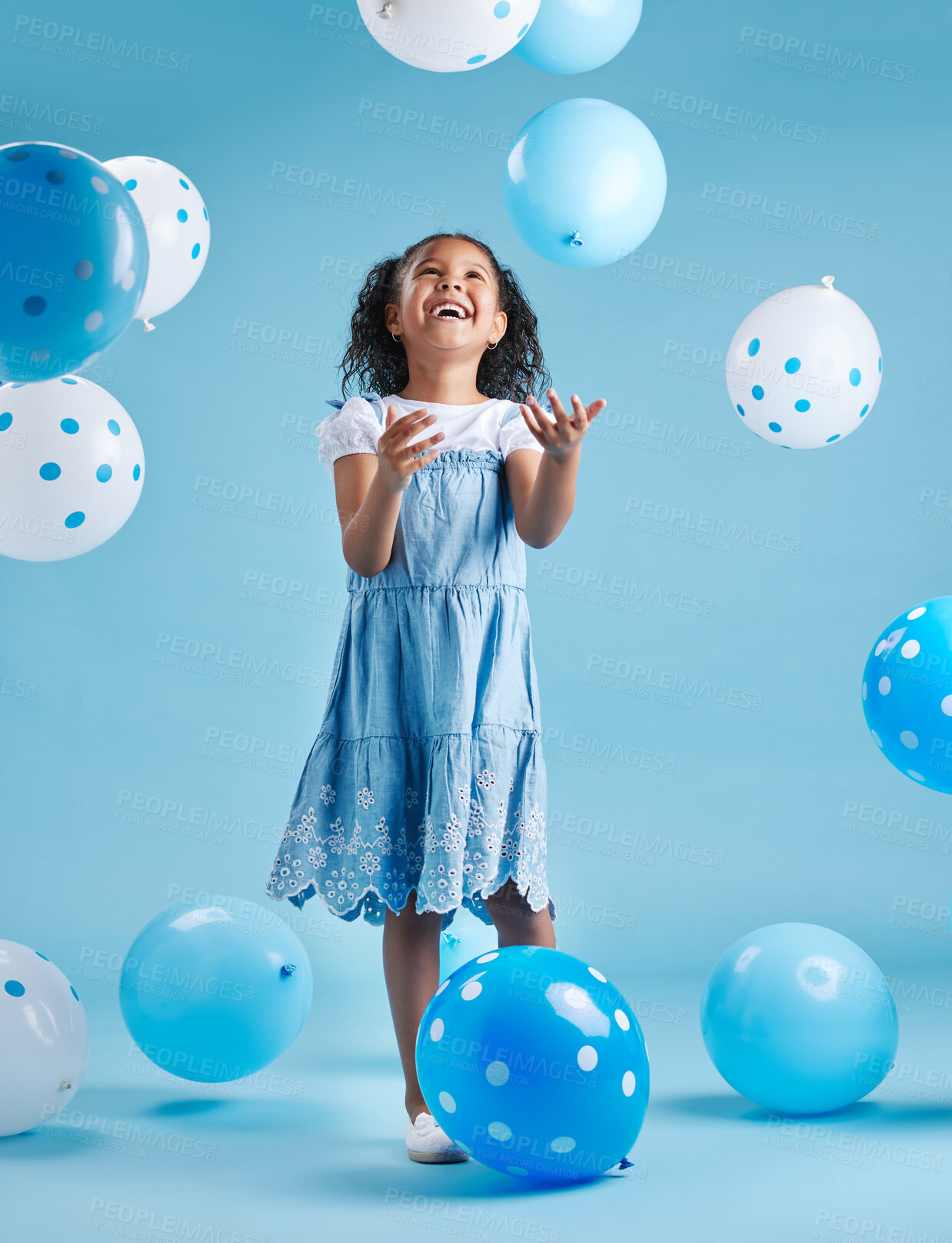 Buy stock photo Balloons, celebration and excited girl isolated on blue background for happy birthday, winning or party. Child, winner or kid with balloon cheers, celebrate giveaway and wow or happiness in studio