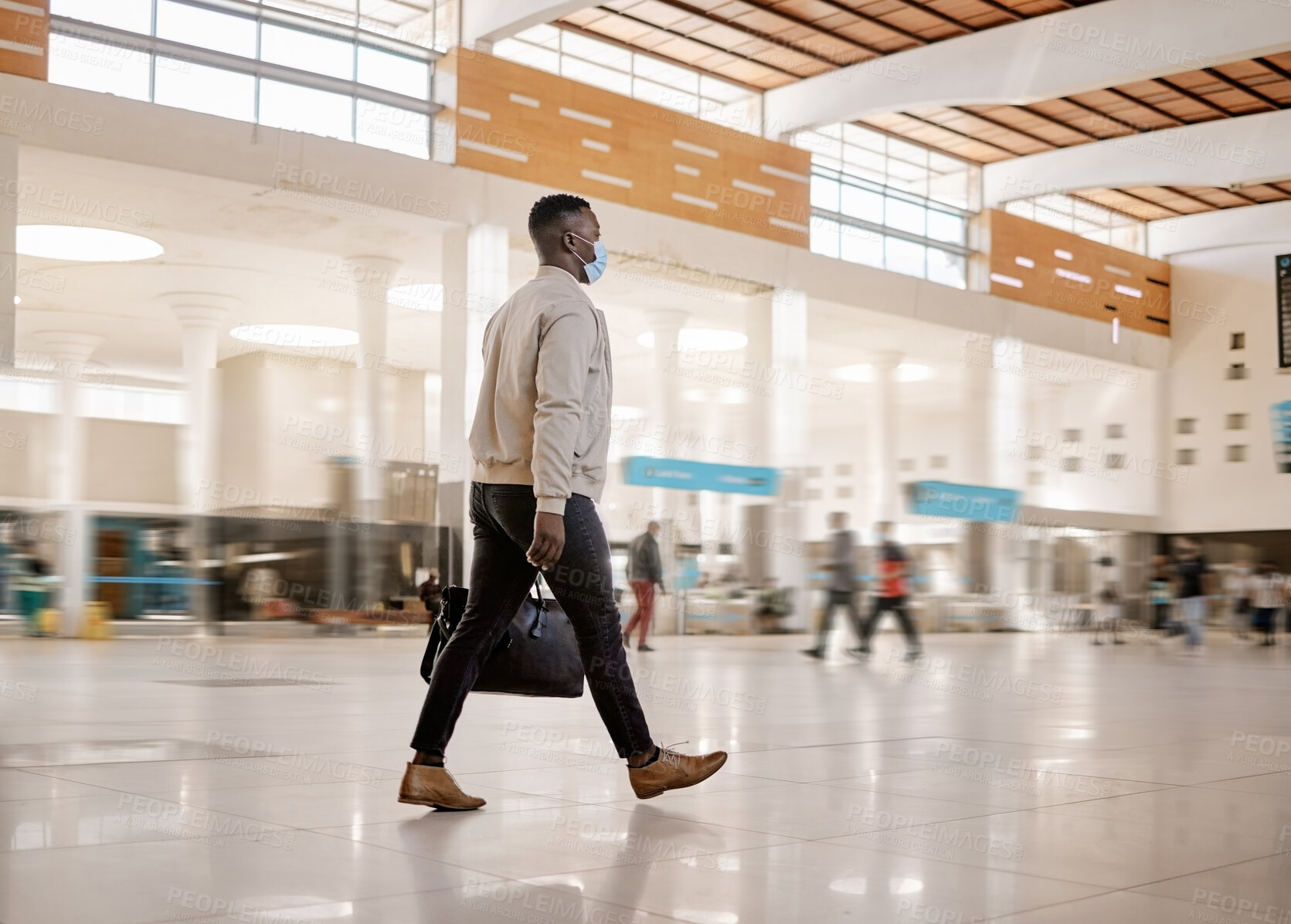 Buy stock photo Walking, travel and business man in lobby for transport, journey and trip for commute for work. Worker, professional and person with bag in airport, train station or  city terminal with face mask