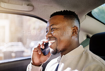 Buy stock photo Black businessman travelling alone in a taxi while talking on a call using his wireless smartphone device in the morning on his way to work in the city