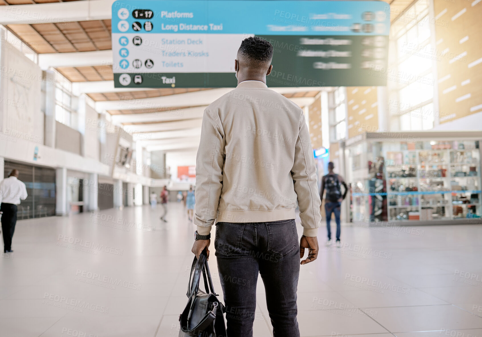 Buy stock photo Sign, travel and business man in train station for public transport, journey and trip for commute to work. Reading schedule, professional and person with bag in railway terminal, lobby and platform