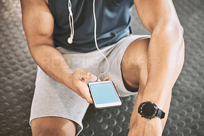 Buy stock photo Phone screen of an athlete sending a text in the gym. Fit trainer online on his cellphone. Bodybuilder taking a break from a workout to use his mobile phone. Hand of a trainer holding his phone