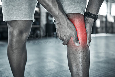 Closeup of hands of athlete with knee pain. Your joint can ache when exercising. Beware of knee pain when bodybuilding. Muscular leg pain is common with exercise. Athlete touching his knee cropped