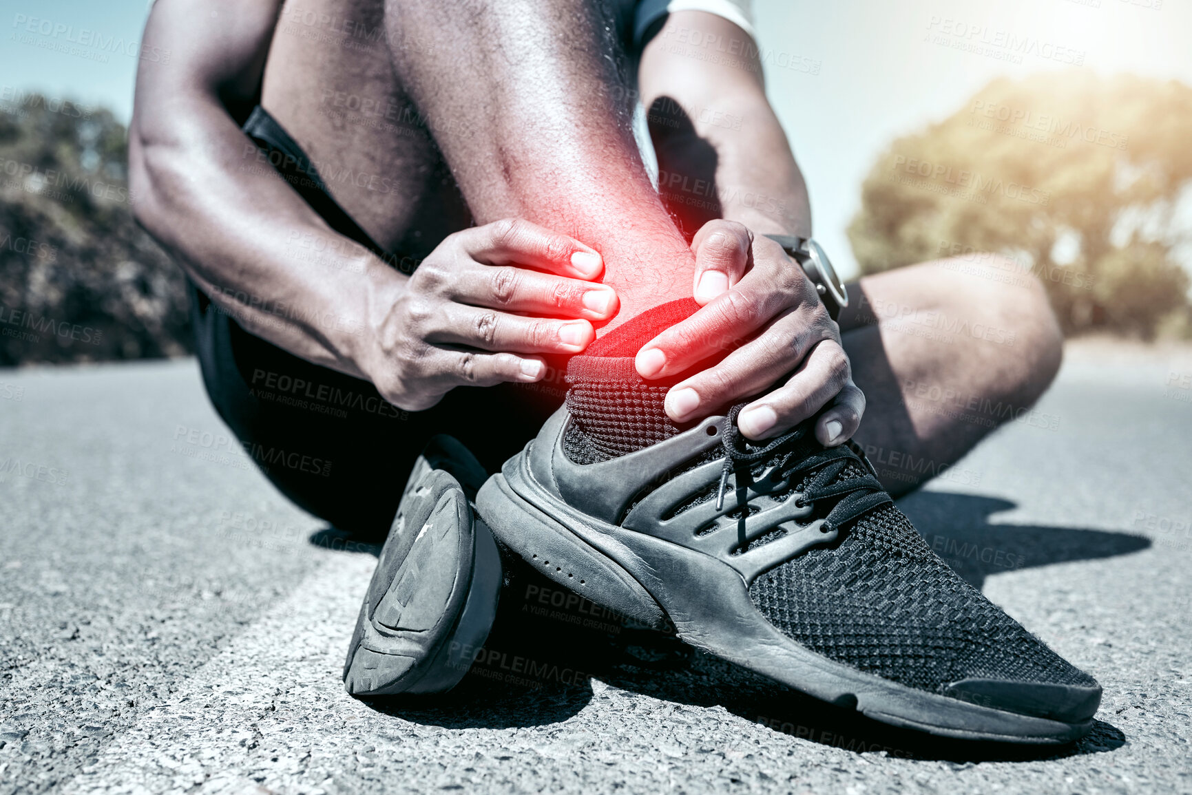 Buy stock photo Fitness, ankle and pain with a sports man holding a joint injury while outdoor for a workout. Exercise, anatomy emergency or accident with a male athlete feeling tender while training for recreation