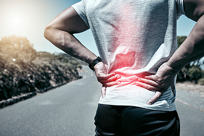 Closeup fit mixed race man holding his back in pain while exercising outdoors. Unrecognizable male athlete suffering with a muscle injury highlighted by glowing cgi. You can get hurt during a workout
