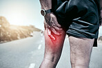 Closeup fit mixed race man holding his leg in pain while exercising outdoors. Unrecognizable male athlete suffering with a muscle hamstring injury highlighted by cgi. You can get hurt during a workout