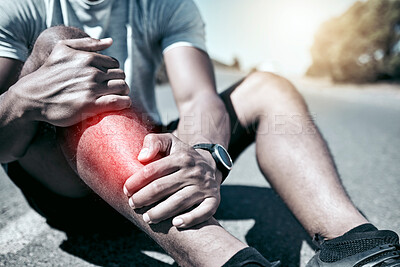 Buy stock photo Closeup fit mixed race man holding his leg in pain while exercising outdoors. Unrecognizable male athlete suffering with shin splints highlighted by glowing cgi. You can get hurt during a workout