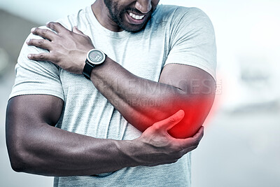 Closeup fit mixed race man holding his elbow in pain while exercising outdoors. Unrecognizable male athlete suffering with a joint injury highlighted by glowing cgi. You can get hurt during a workout