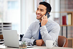 Young happy mixed race businessman on a call using a phone and  sitting in an office at work. One hispanic male businessperson talking on the phone while thinking at work