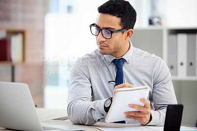 Buy stock photo Writing, computer and business man, accountant or employee of finance, budget or analysis in career notebook. Journal, bookkeeping notes and person reading financial report on laptop for job priority