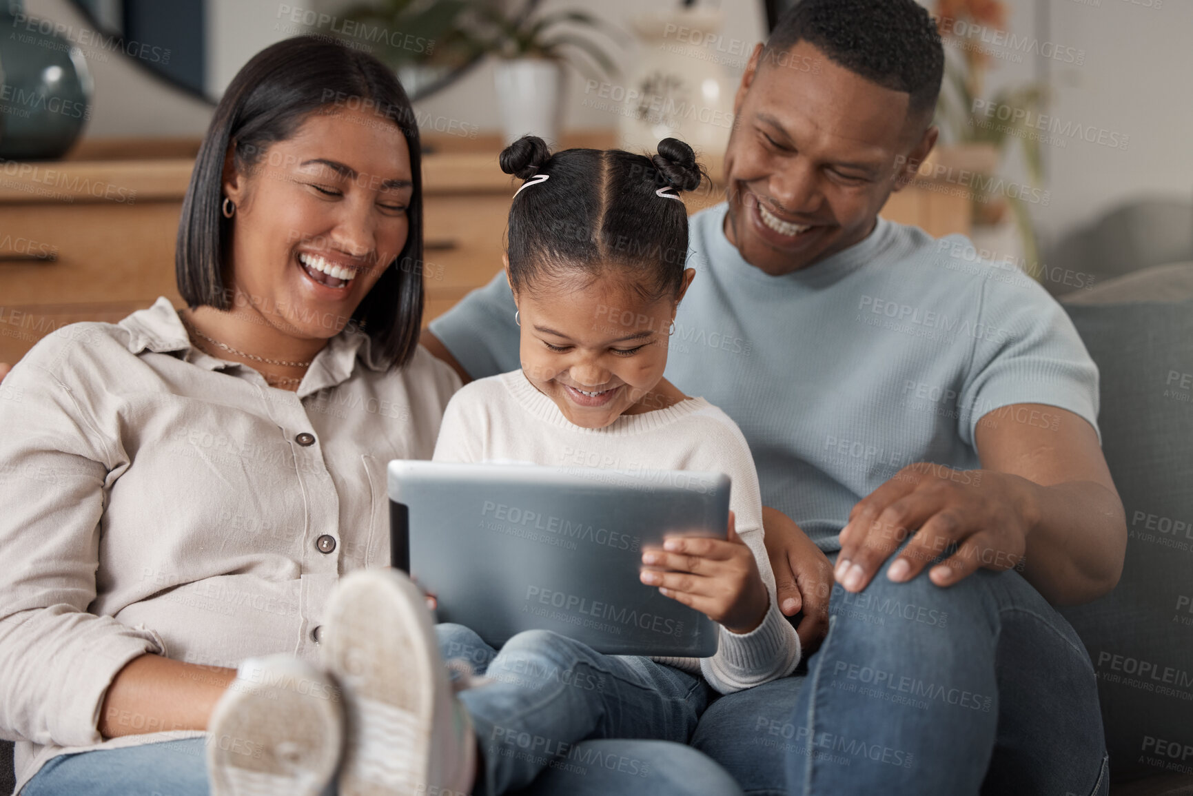 Buy stock photo Happy, black family and relax on sofa with tablet in home, living room for watching, streaming movie or website. Parents, girl and watch cartoon, entertainment together on technology, app or screen