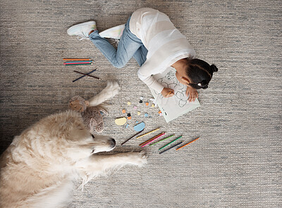 Buy stock photo Girl kid, book and floor with dog, drawing and top view for learning, education or development in family home. Female kid, color pencil and art with notebook, writing or pet animal on carpet in house