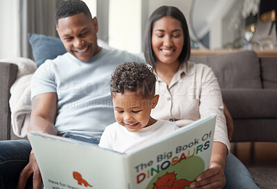Buy stock photo Mother, father and child reading books on living room floor for educational fun, learning and development at home. Happy family, parents and boy kid smile for dinosaur, storytelling or play in lounge