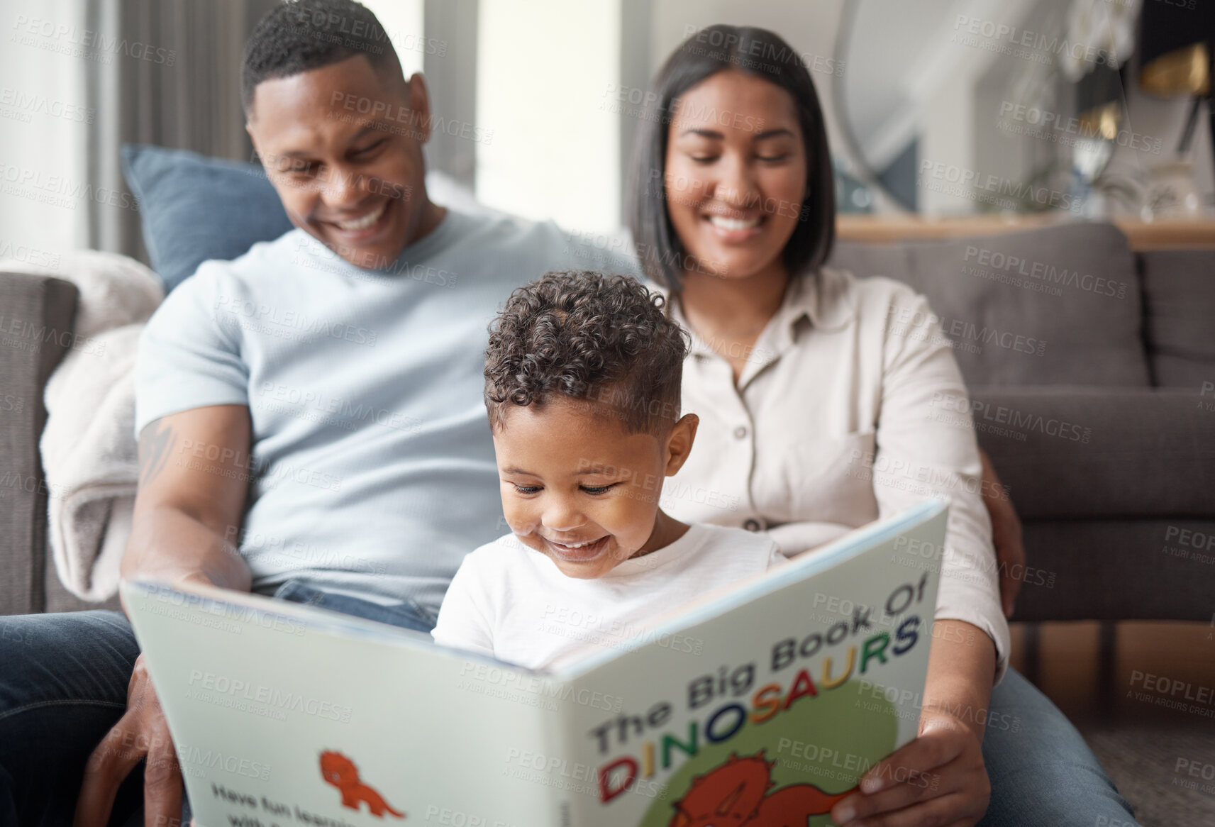 Buy stock photo Mother, father and child reading books on living room floor for educational fun, learning and development at home. Happy family, parents and boy kid smile for dinosaur, storytelling or play in lounge