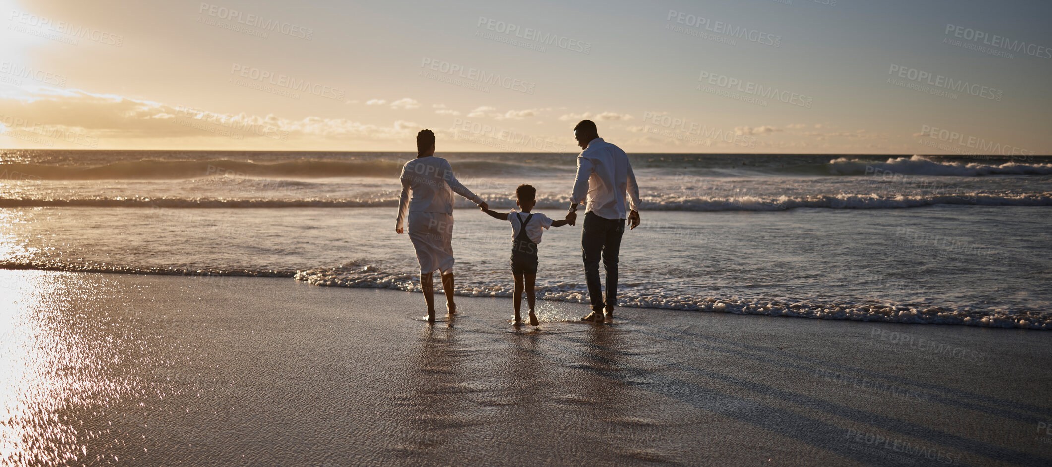 Buy stock photo Black family, holding hands and walking on beach for relax with bonding, adventure and holiday fun with back. African people, parents and child at ocean for travel, support and enjoyment in summer