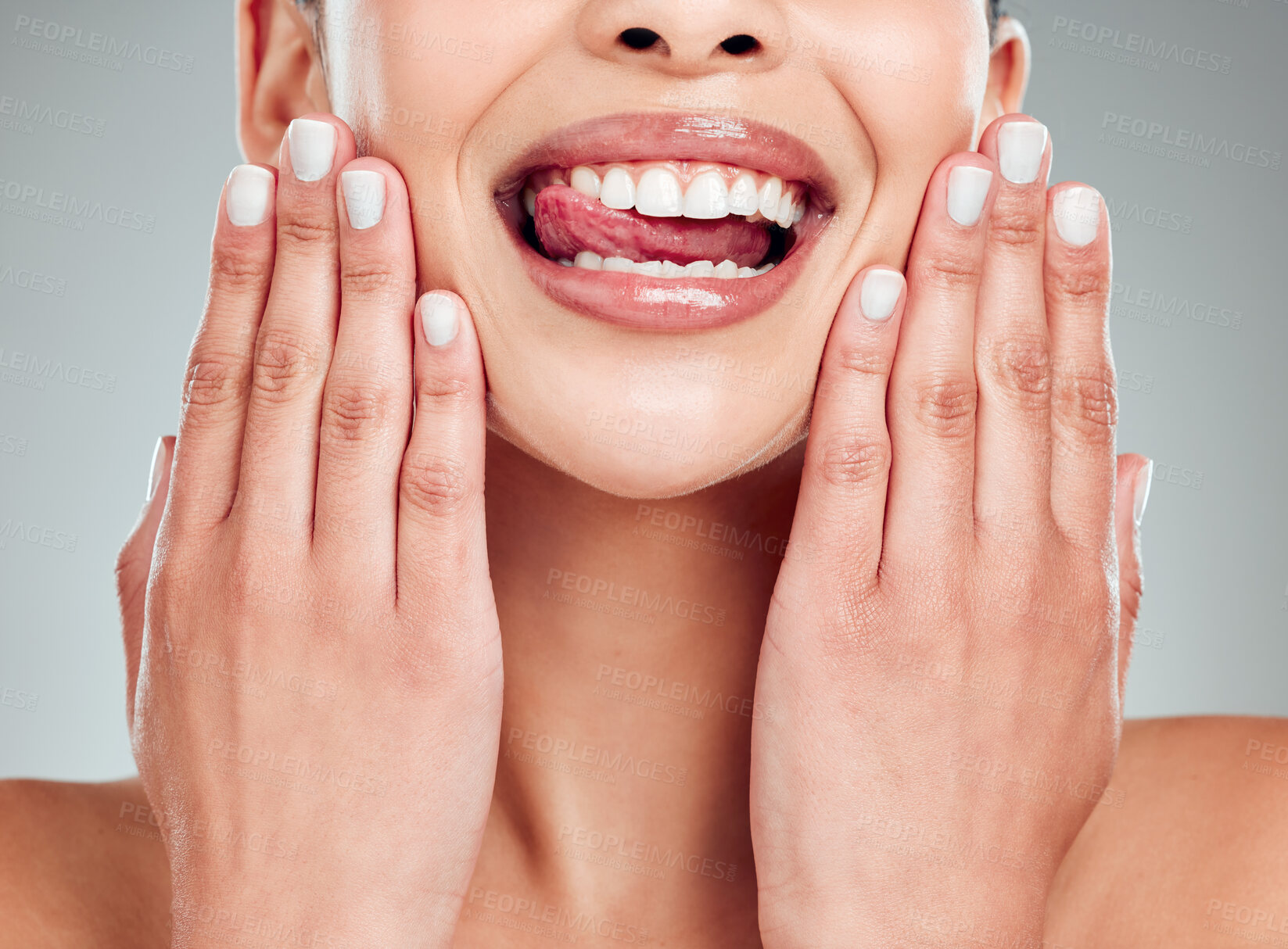 Buy stock photo Woman, teeth and mouth in studio for beauty, lips and veneers with tongue, smile and hygiene in closeup. Female person, model and whitening for oral care, healthy gum and  cleaning with nail manicure