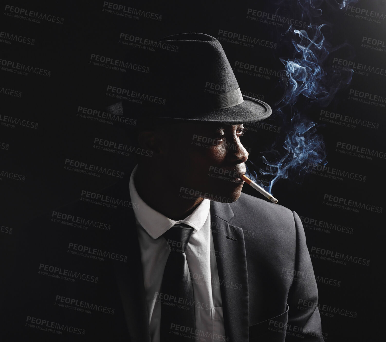 Buy stock photo Man, gangster and cigarette in studio by dark background with smoke, silhouette and dangerous in shadow. Mafia, secret agent or male in night for smoking with vintage aesthetic by black backdrop