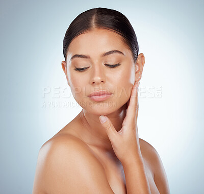 Buy stock photo Face, smooth skincare and beauty of woman in studio isolated on a white background. Natural, serious and female model in makeup, cosmetics or facial treatment for skin health, aesthetic or wellness.
