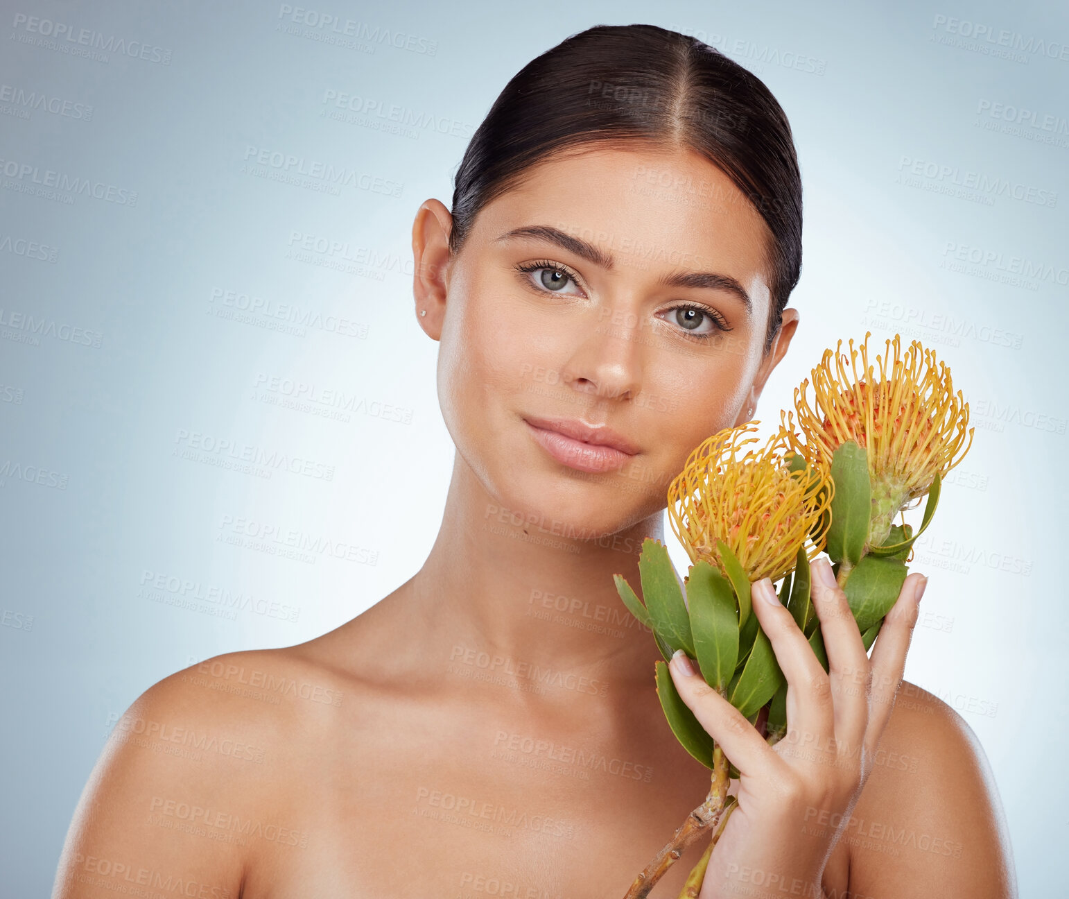 Buy stock photo Face, skincare and woman with protea flowers in studio isolated on a white background. Portrait, natural and female model with floral pincushion plants for makeup, cosmetics and beauty skin treatment