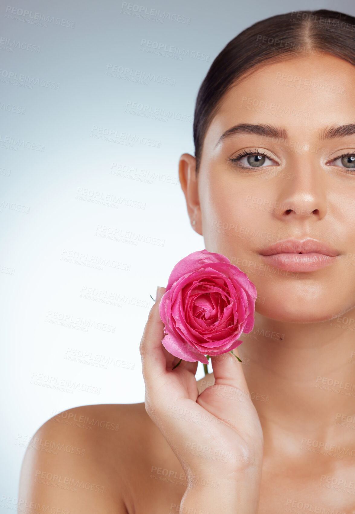 Buy stock photo Face, skincare and woman with rose flower in studio isolated on a white background. Portrait, natural plant and serious female model with pink floral for makeup cosmetics, beauty treatment and mockup