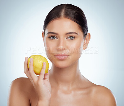 Buy stock photo Face, skincare and woman with lemon in studio isolated on a white background. Portrait, natural fruit and serious female model with vitamin c, nutrition and healthy diet, wellness or beauty cosmetics